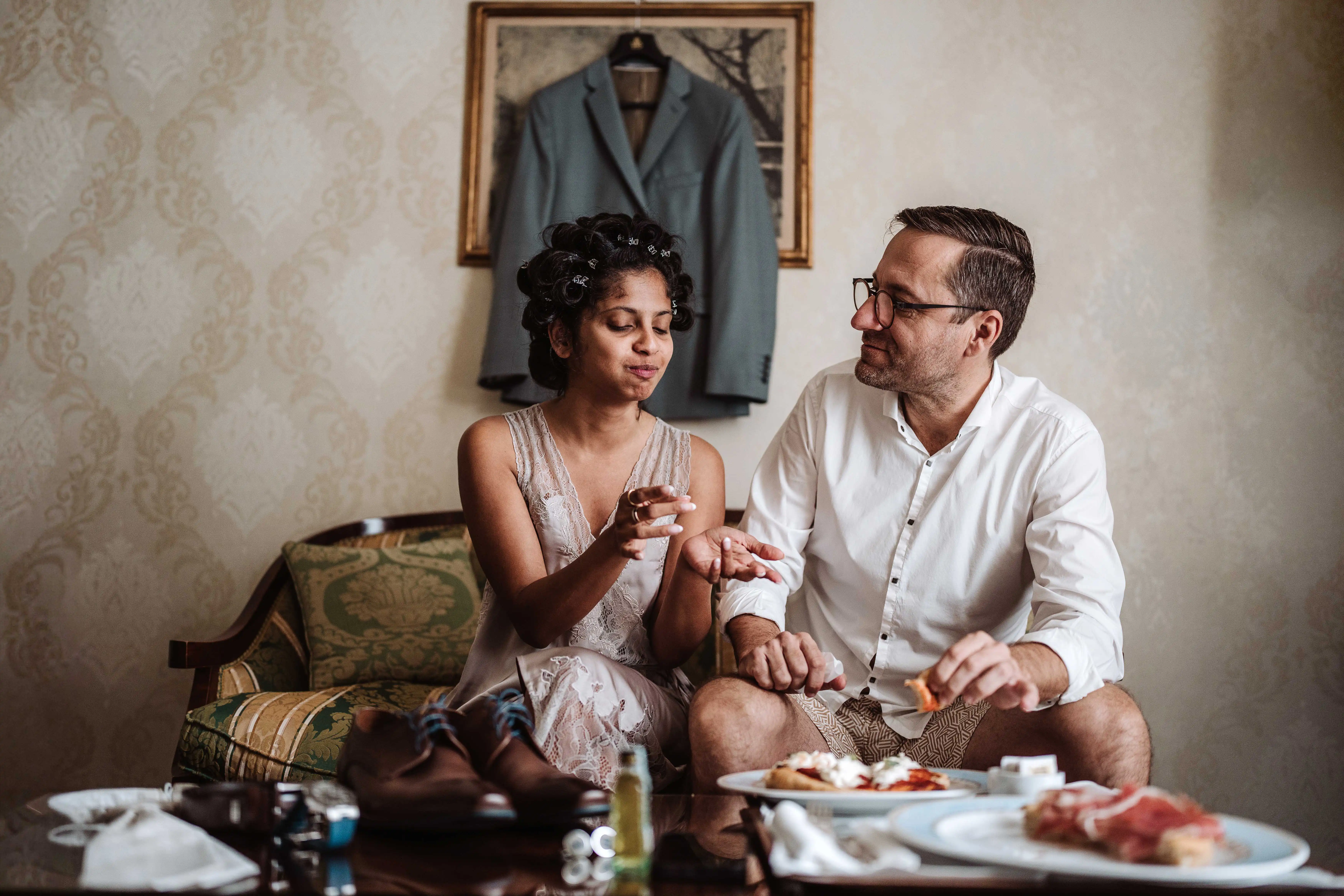 bride and groom getting ready together in hotel room lake como wedding