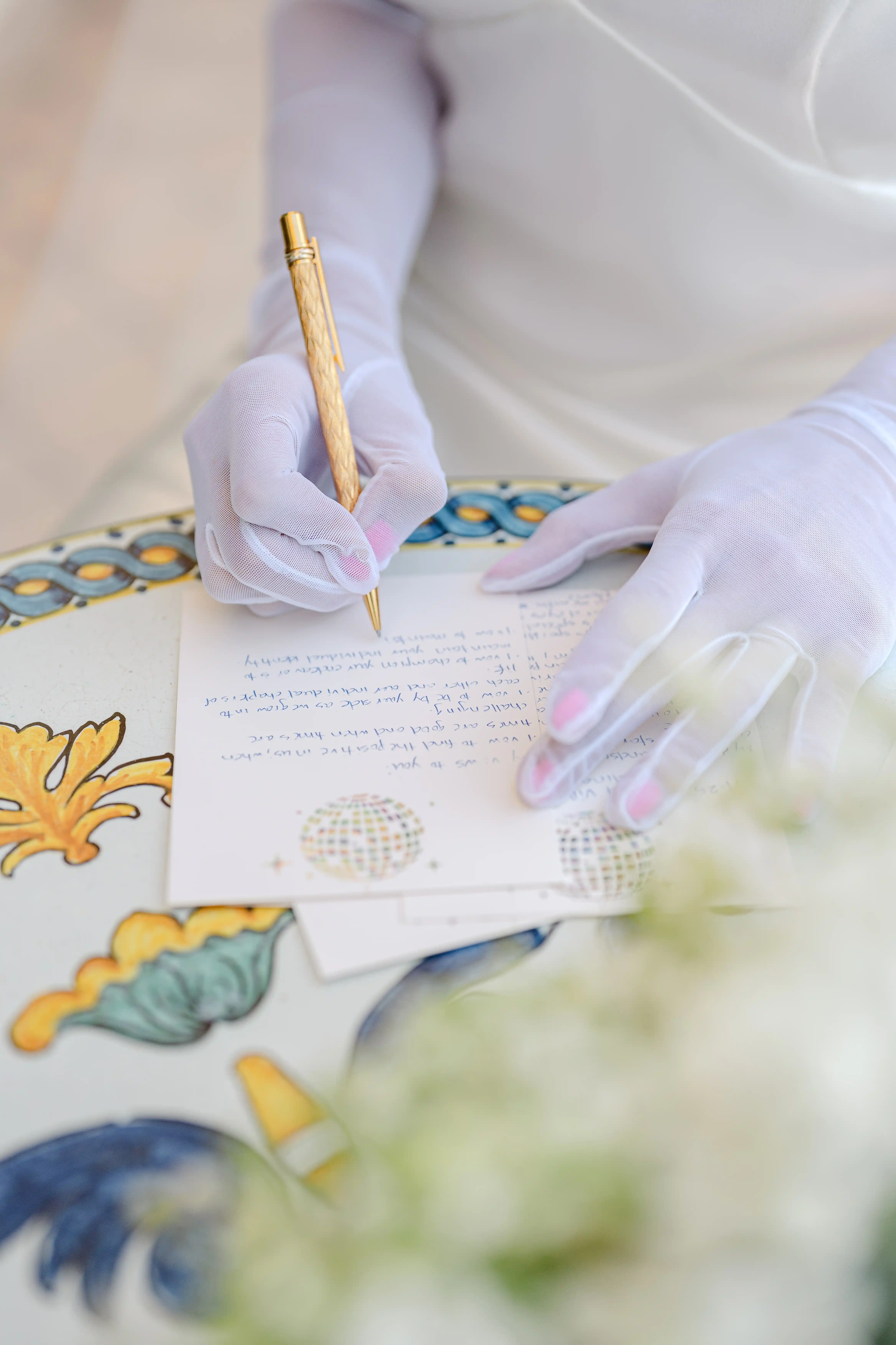 Bride writing wedding vows with gold pen during intimate elopement in Taormina