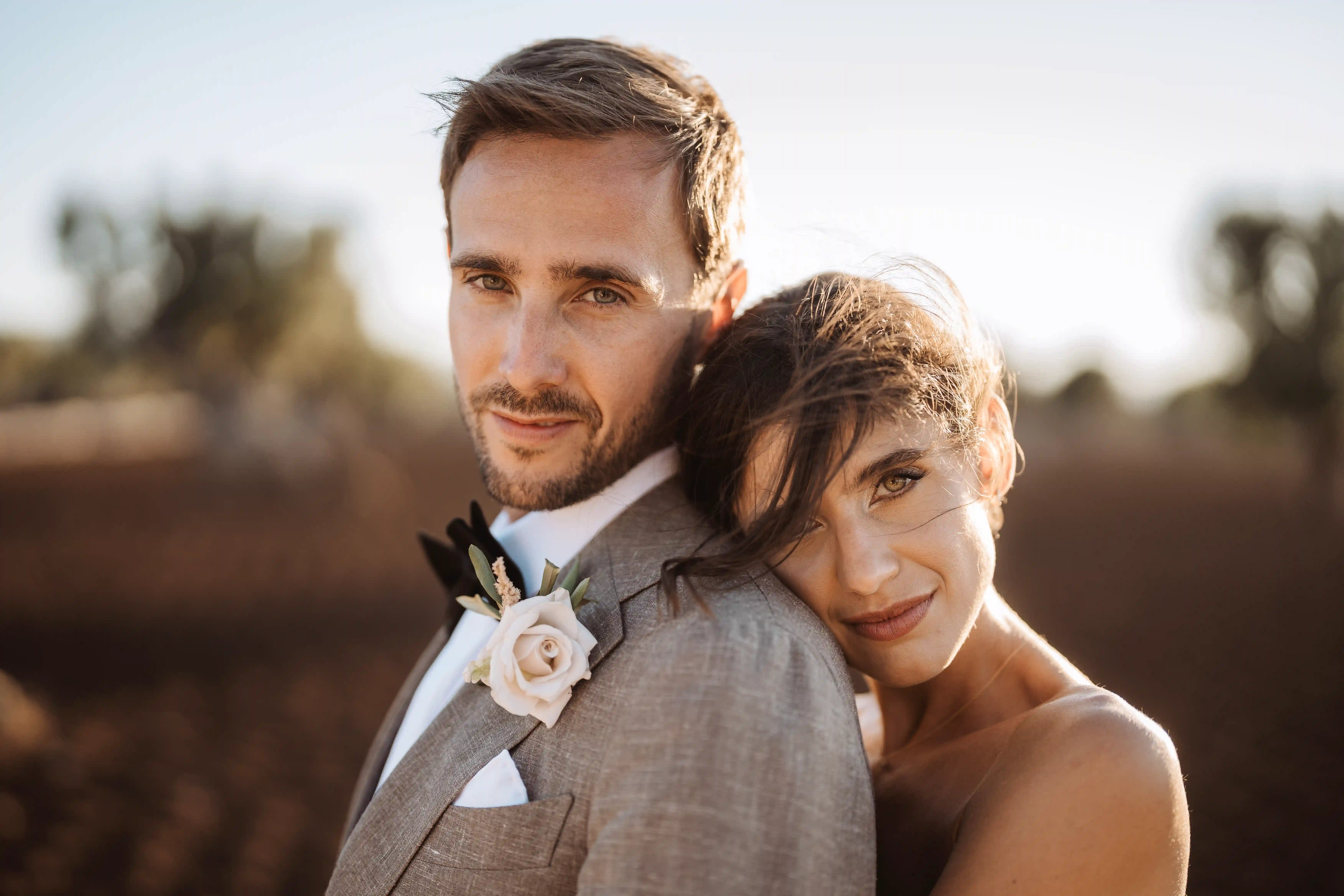 Elegant wedding couple portrait in Puglia with warm sunset light, fine art Italian wedding photography